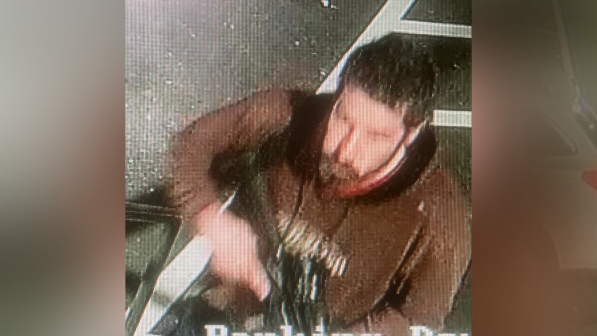 Suspect seen in picture carrying a gun
