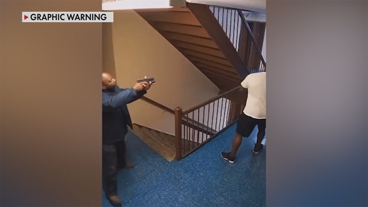 A gun man points his weapon at a neighbor before opening fire and killing him