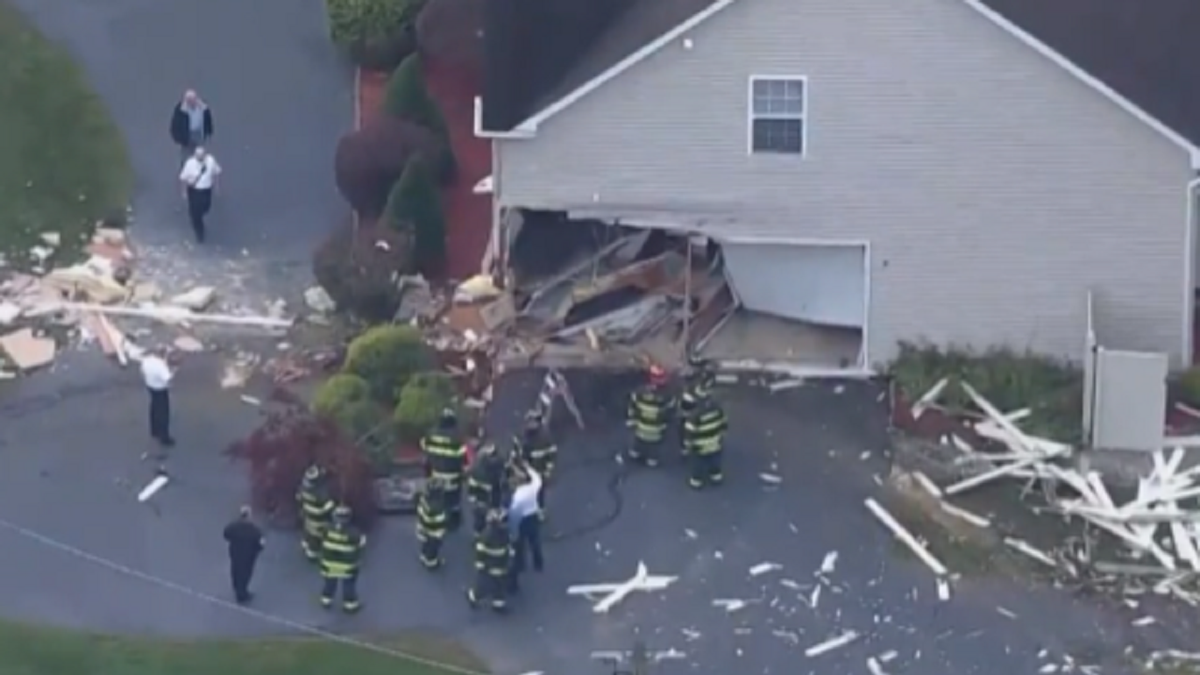 Damage to home in New Jersey hit by school bus
