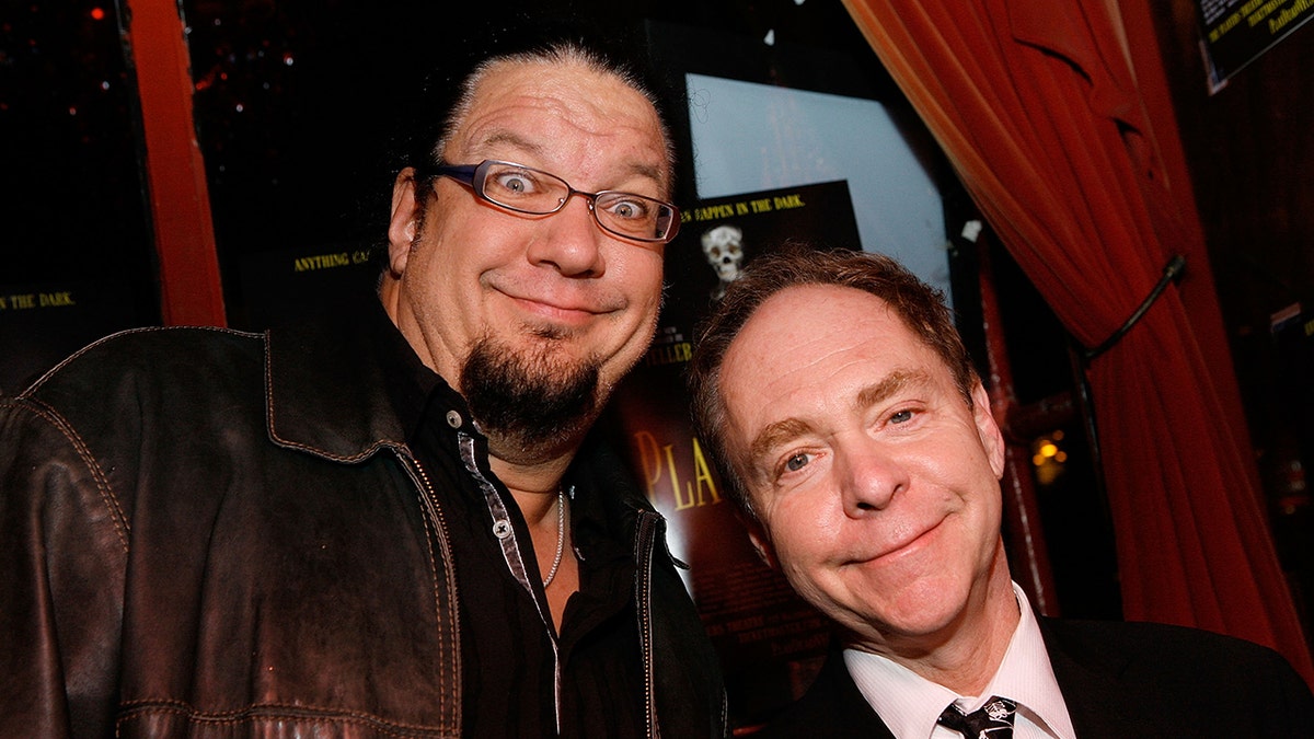 Penn and Teller pose for a photo