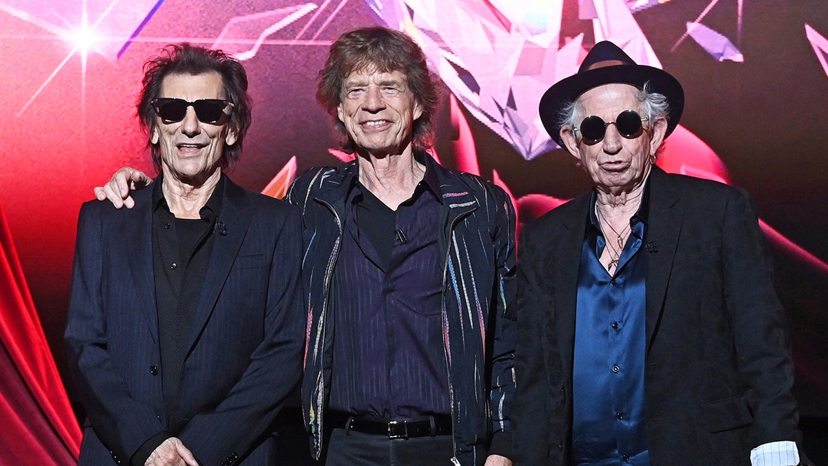 Ronnie Wood, Mick Jagger, and Keith Richards pose together