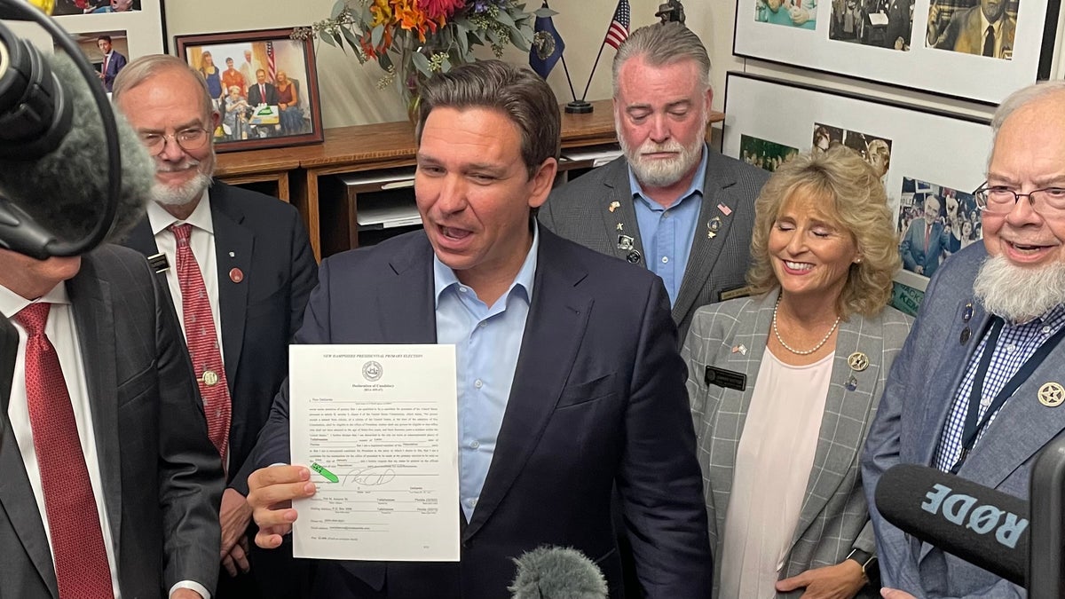 Florida Gov. Ron DeSantis files to place his name on New Hampshire's GOP presidential primary ballot at the Statehouse in Concord, New Hampshire, on Oct. 12.