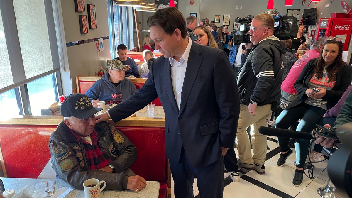 Florida Gov. Ron DeSantis, a 2024 Republican presidential candidate, speaks with customers at the Red Arrow Diner in Londonderry, New Hampshire, on Oct. 24 2023.