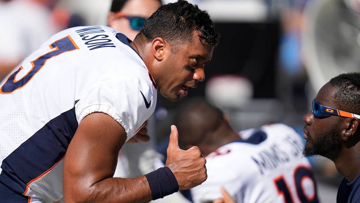 Russell Wilson talks to his bench