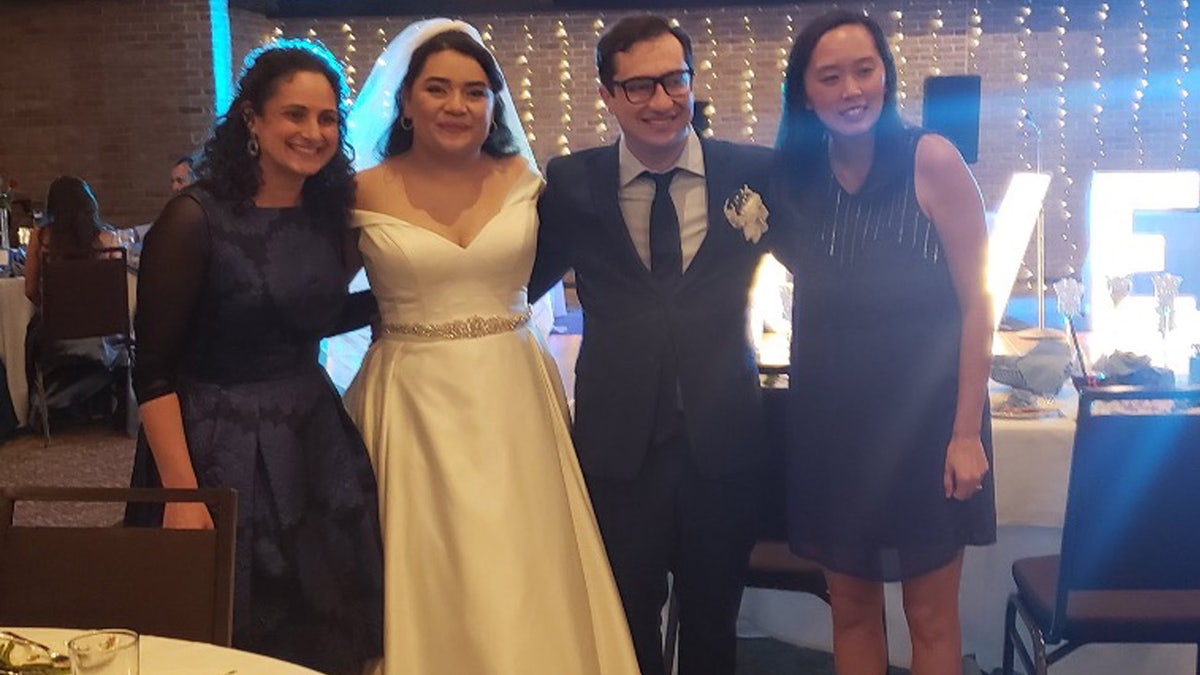 Samantha Woll poses with bride and groom Miriam and Jake Stone and Stephanie Chang, a Democratic state senator
