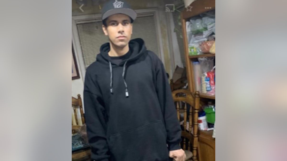 Pete Renteria in black sweatshirt and cap