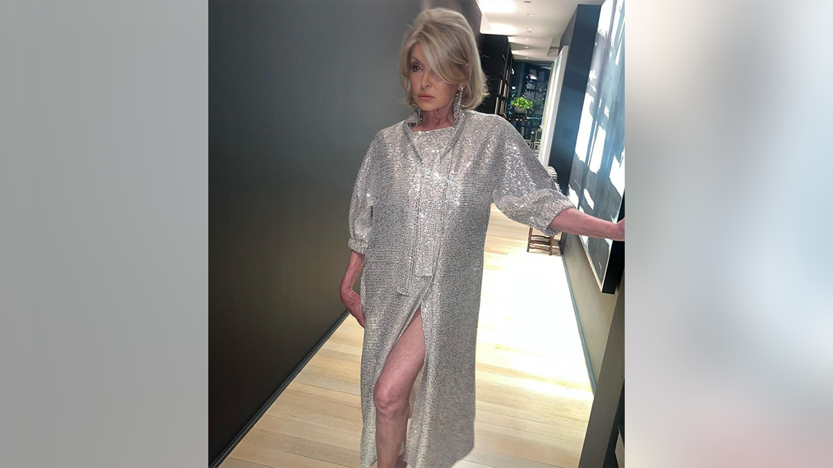 Martha Stewart shoes some leg in a dress slit 