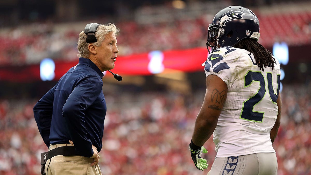 Pete Carroll talks with Marshawn Lynch