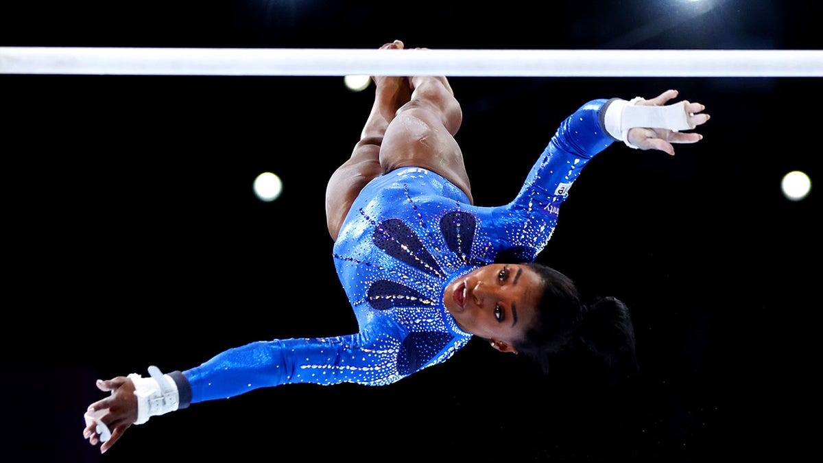 Simone Biles competes on uneven bars