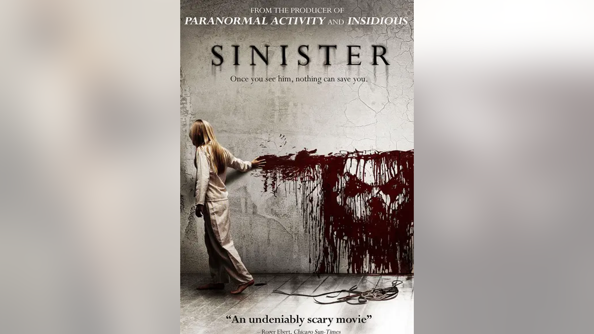 Movie poster of "Sinister" with woman dragging blood on wall looking like a face