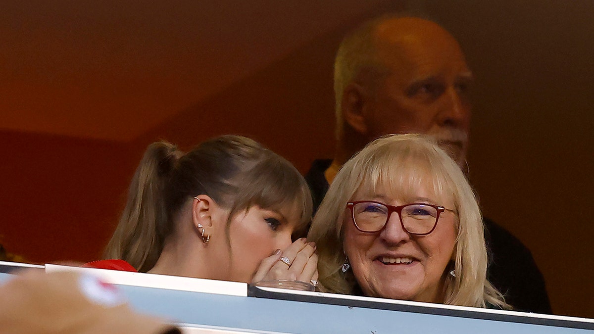 Taylor Swift whispers to Donna Kelce