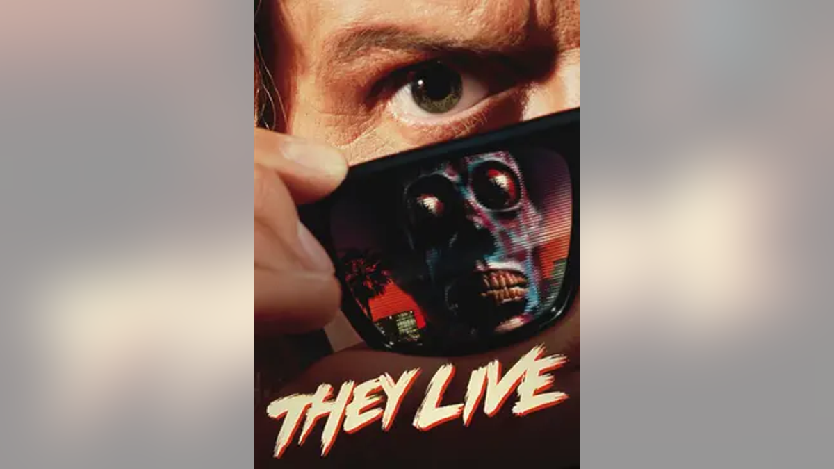 Movie poster of "They Live" with man pulling down sunglasses with creepy reflection