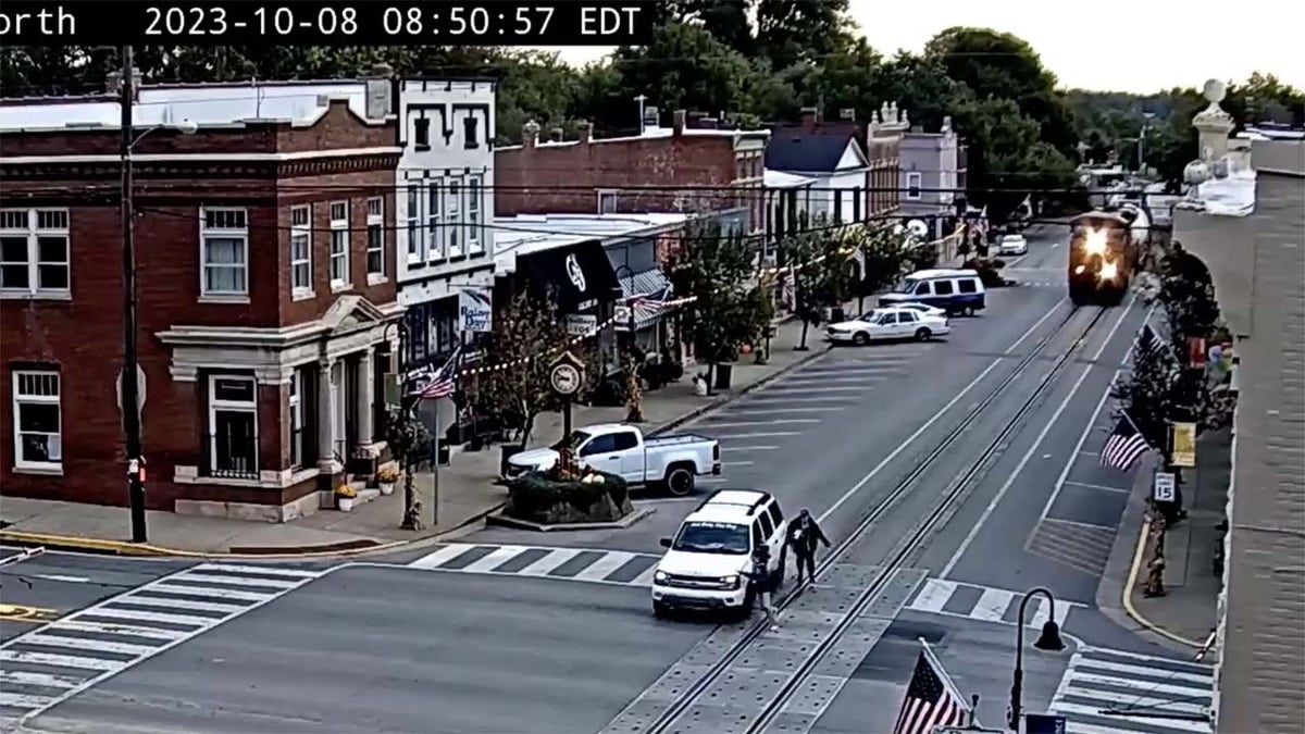 Woman and children caught in stalled car at rail crossing in Louisville KY