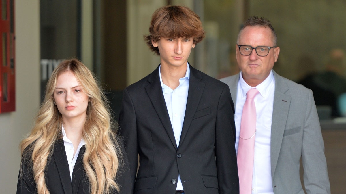 Maya Kowalski; her brother, Kyle Kowalski; and her father, Jack Kowalski, walk beside each other