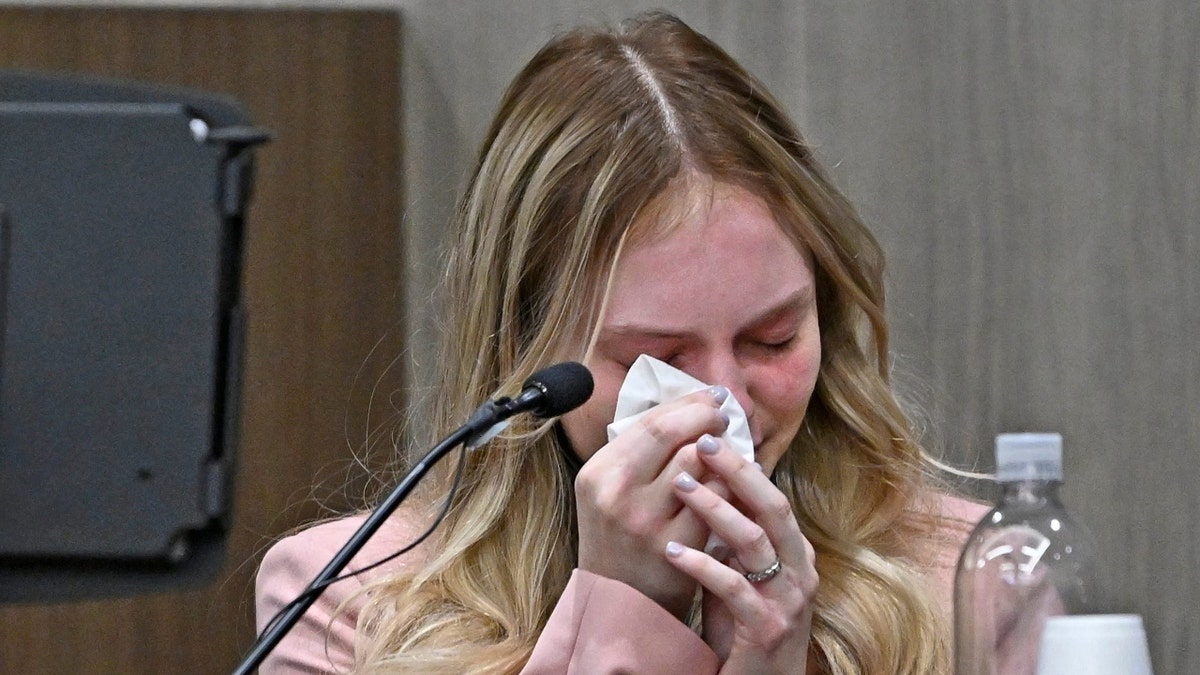 Maya Kowalski wipes her tears with a tissue in court on Oct. 9, 2023