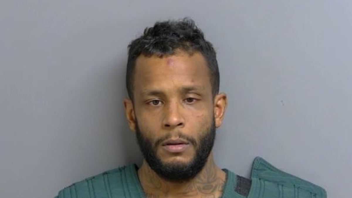 Antonio Andujar-Ruiz seen in a booking picture emotionless after allegedly kidnapping an individual