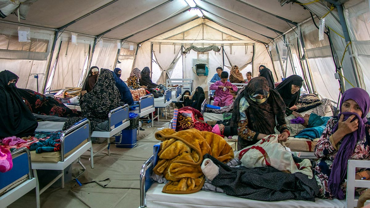 injured afghans in tent