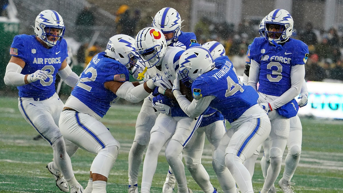 Air Force playing making tackle