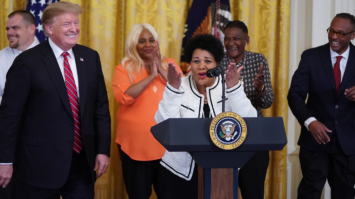 Alice Marie Johnson, who had her sentence commuted by U.S. President Donald Trump (L) after serving 21 years in prison for cocaine trafficking, thanks the press during a celebration of the First Step Act in the East Room of the White House April 1, 2019. (Photo by Chip Somodevilla/Getty Images)