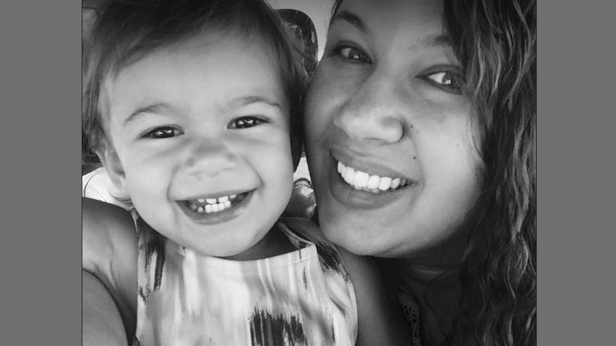 woman and toddler smiling