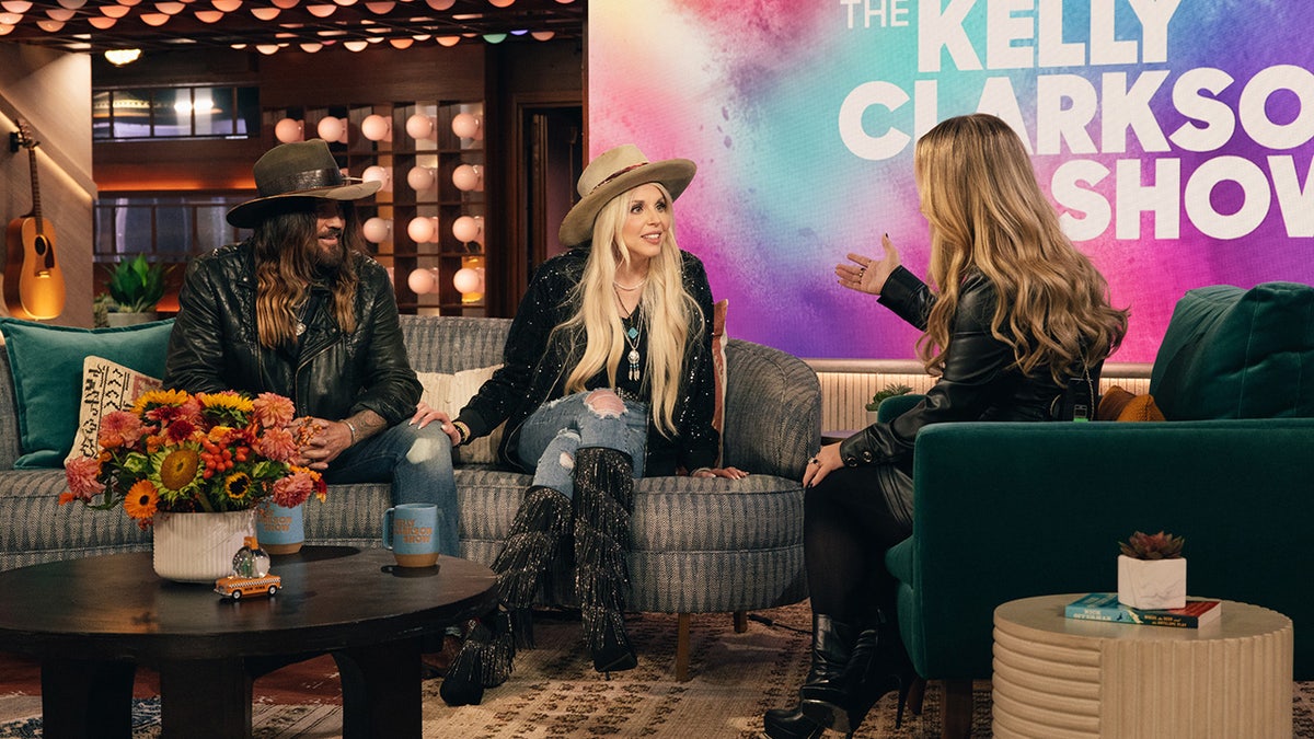 Billy Ray Cyrus and Firerose speaking to Kelly Clarkson on her show