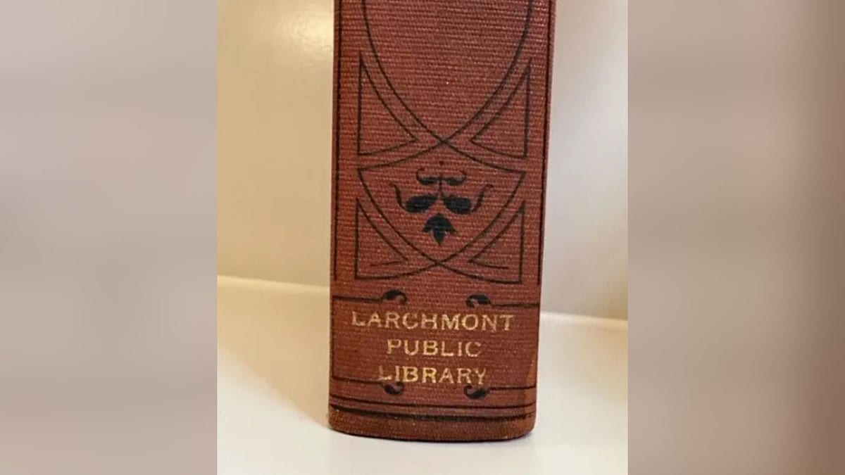 Book spine showing Larchmont Public Library