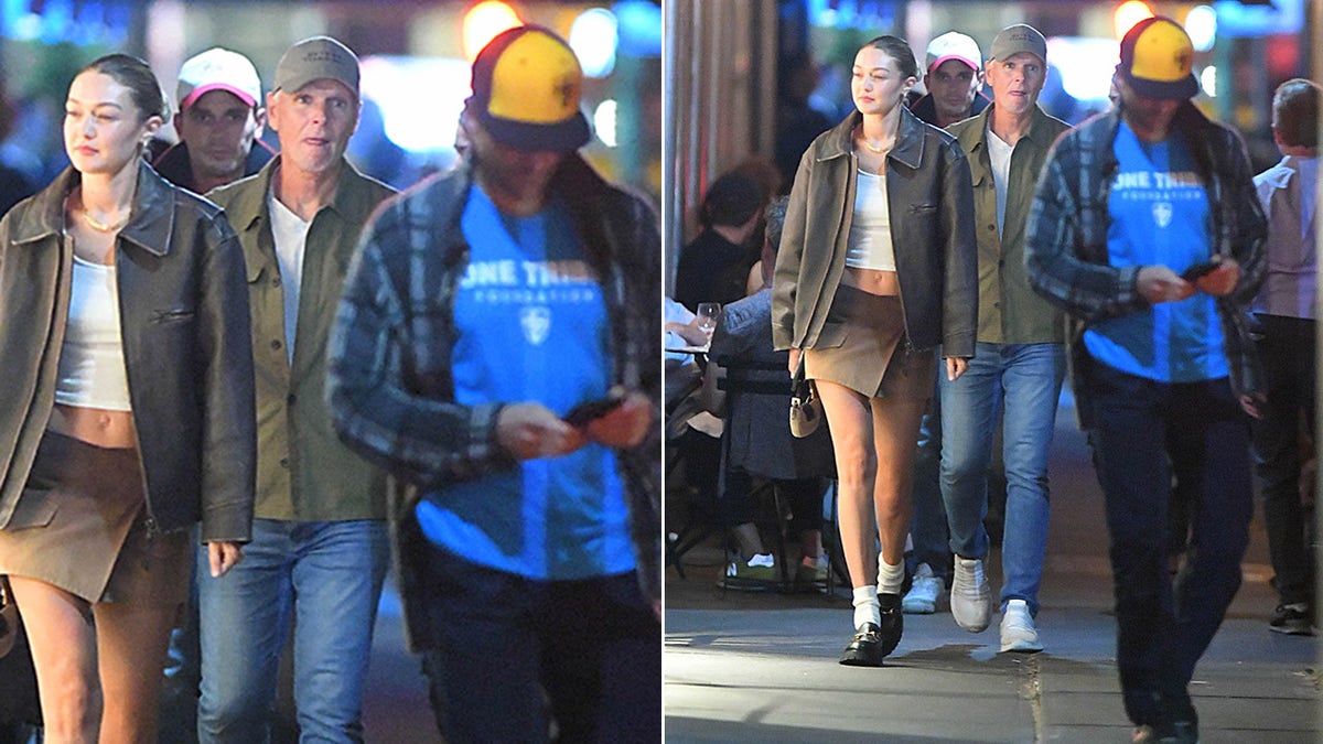 Bradley Cooper texts on his phone while leaving dinner with Gigi Hadid
