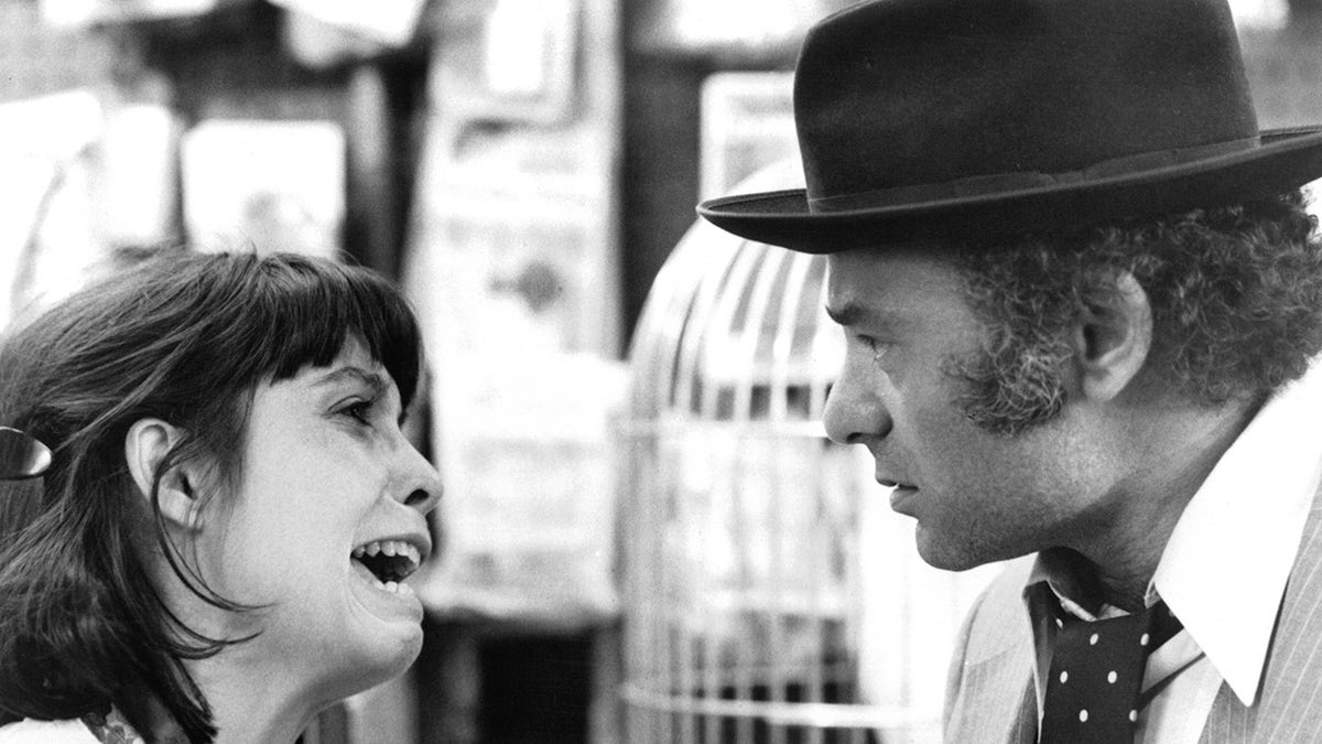 Burt Young and Talia Shire argue in a scene from Rocky II