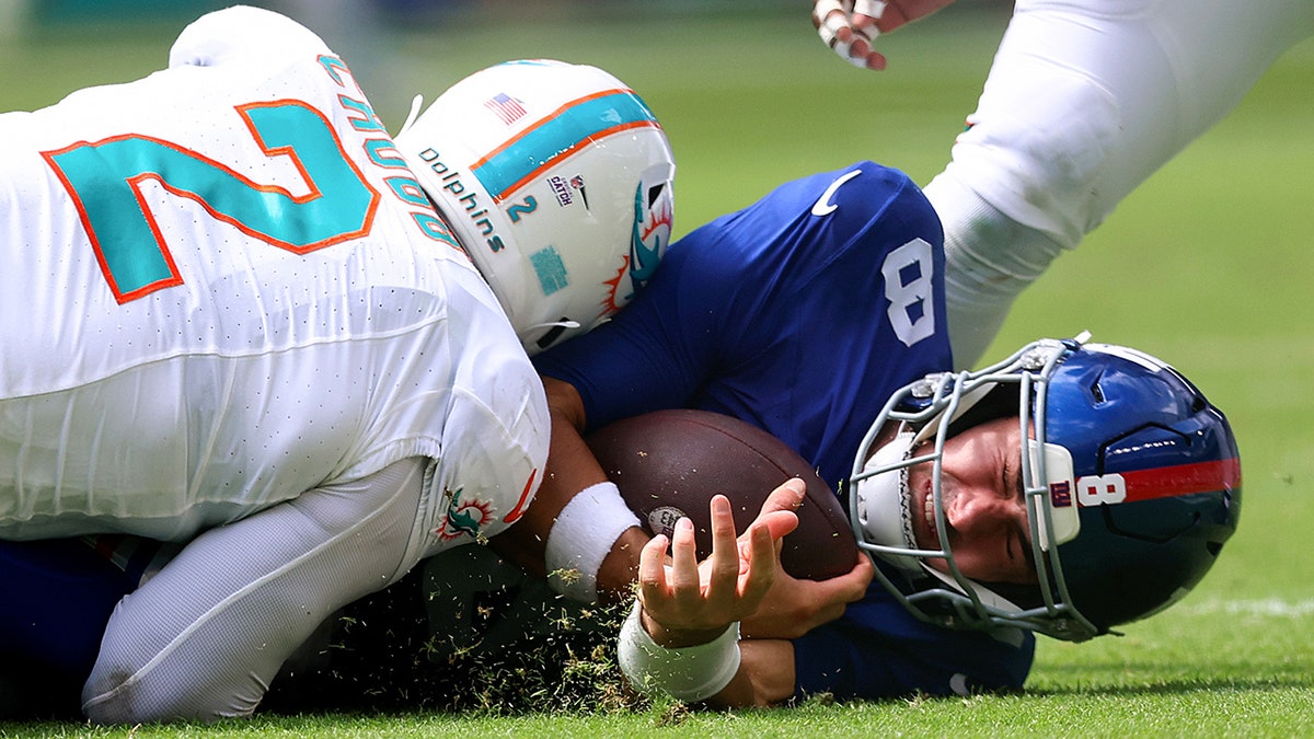 Daniel Jones gets sacked during a game against Miami
