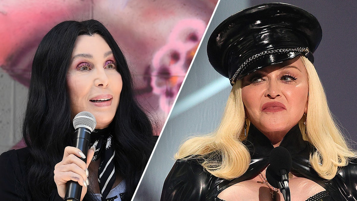 Cher holds the microphone and looks to her left split Madonna in a latex outfit and hat looks to her right