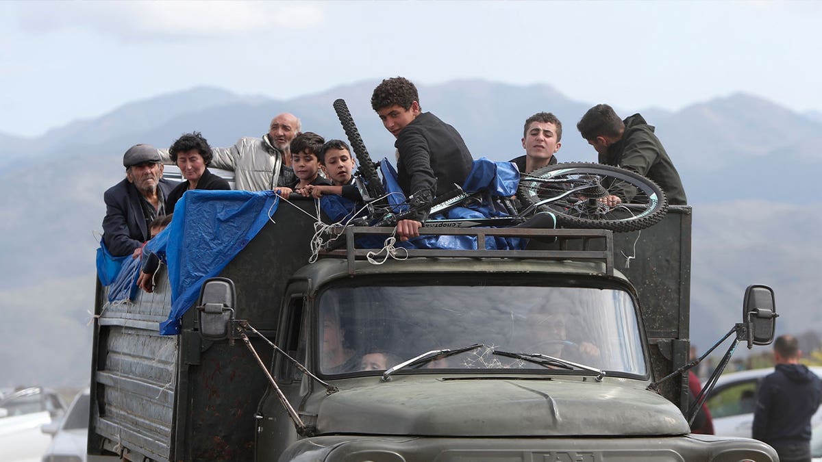 Ethnic Armenians travel in truck
