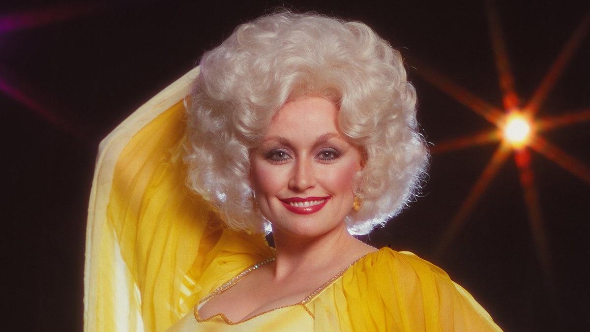 Dolly Parton in a yellow dress