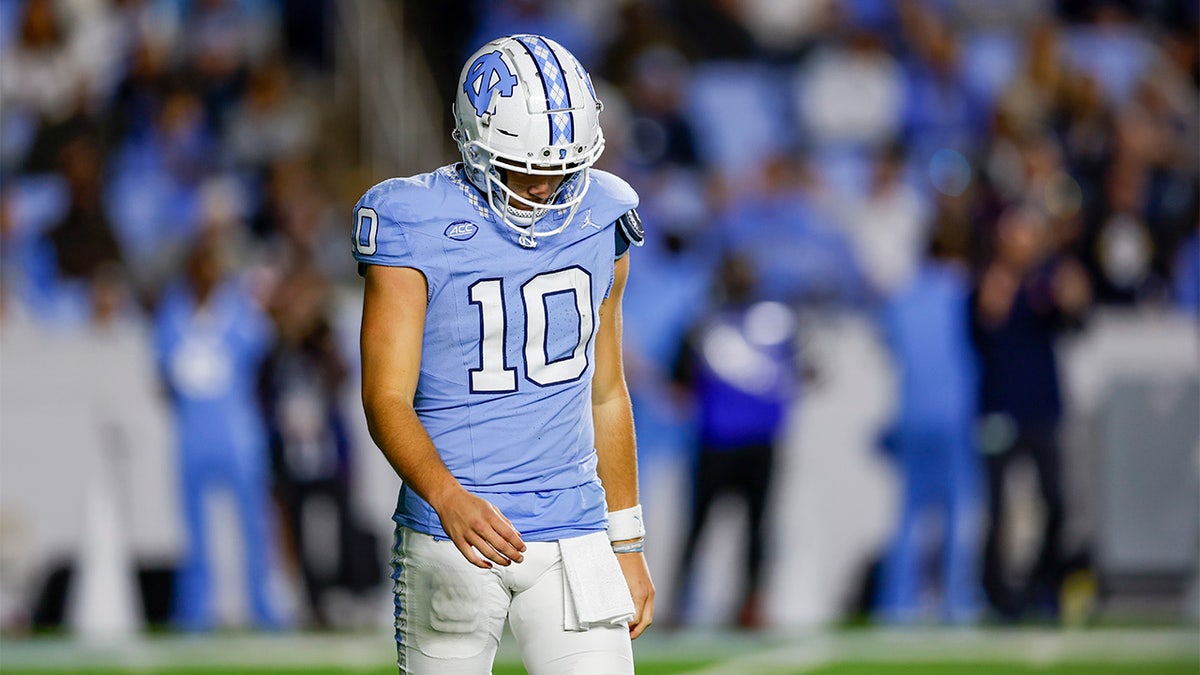 Drake Maye walks off the field