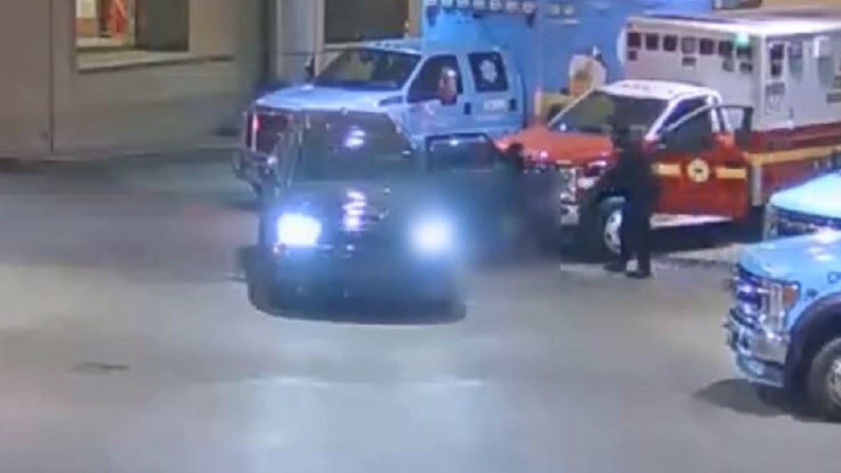Video footage of a suspect dragging another suspect out of a black SUV in Philadelphia