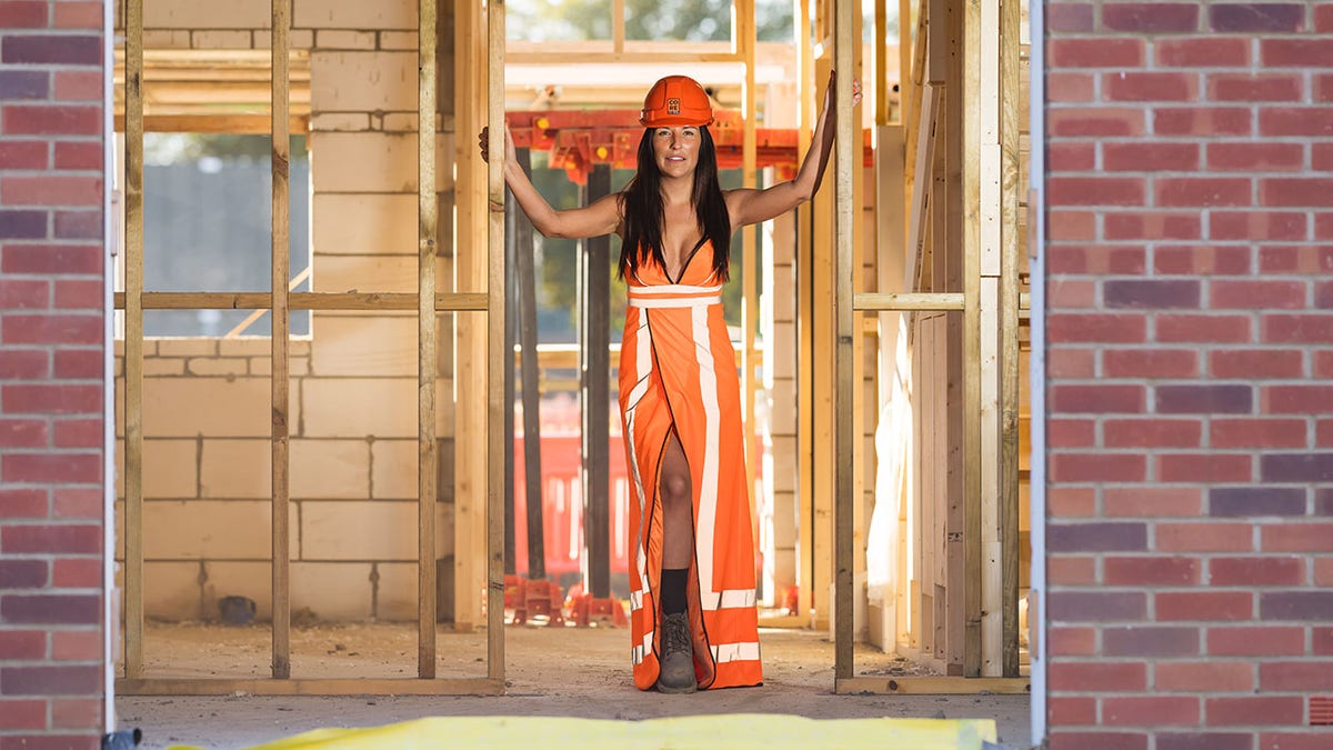 woman posing in dress and boots