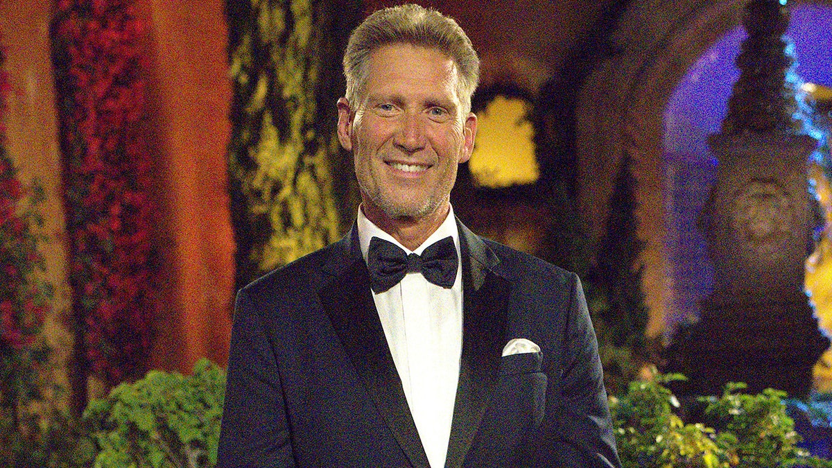 Gerry Turner smiles in a tuxedo outside the "Bachelor" mansion
