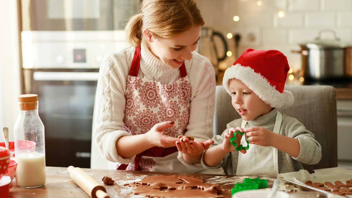 mother and son making cookies