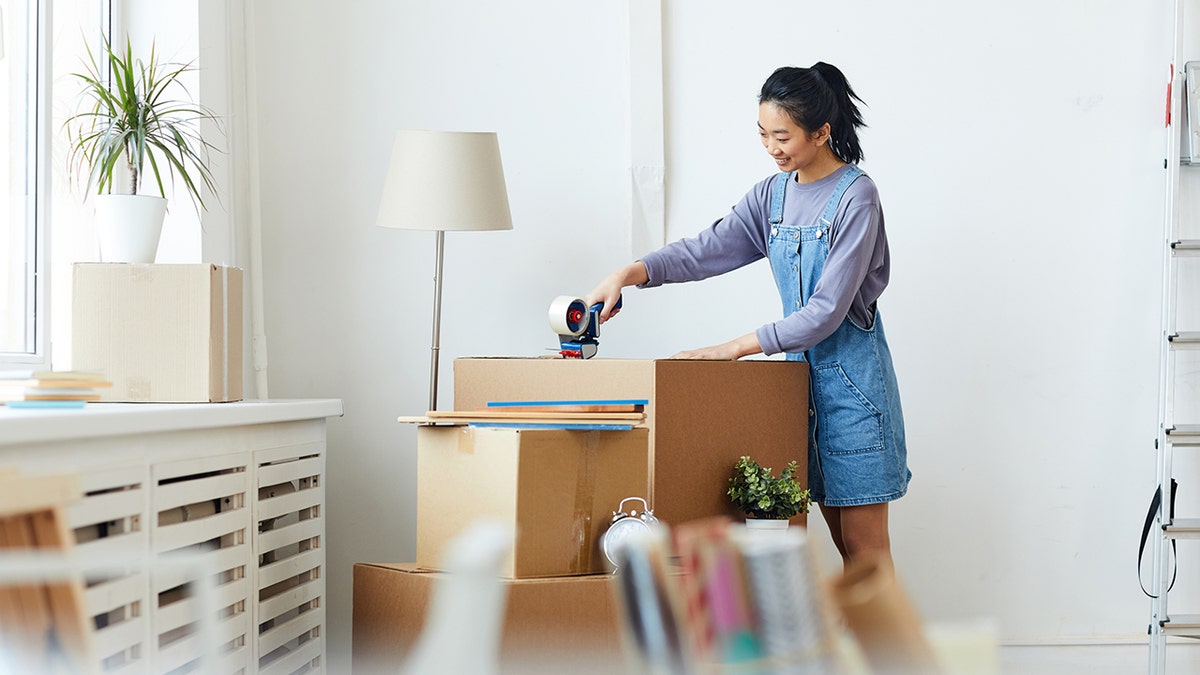 woman packing boxes