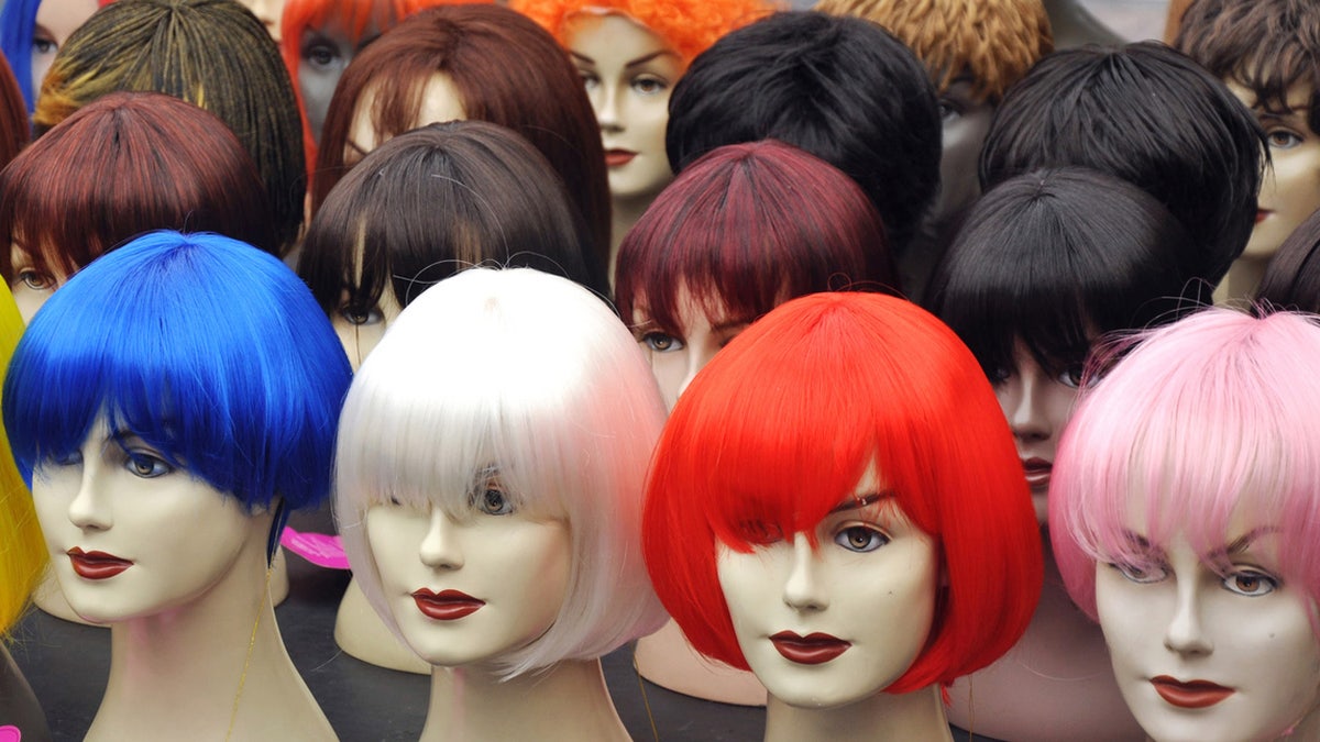 ghostface horror movie Wigs set on mannequin heads in a store.
