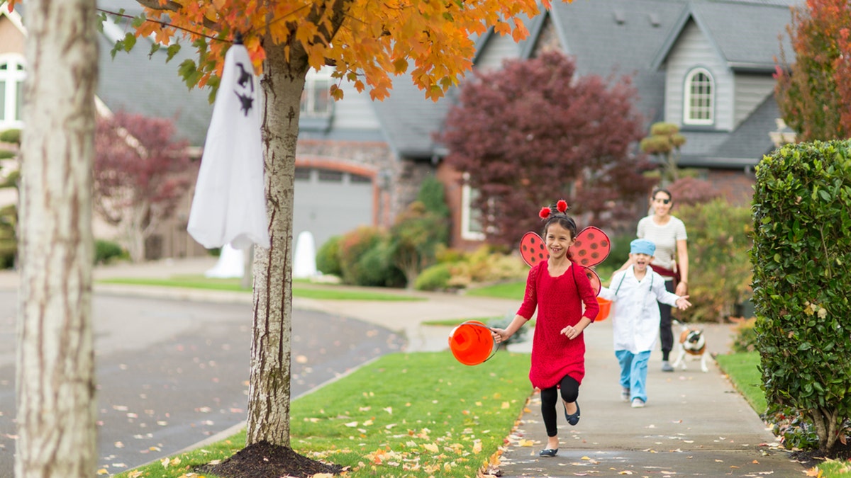 kids trick or treating in neighborhood