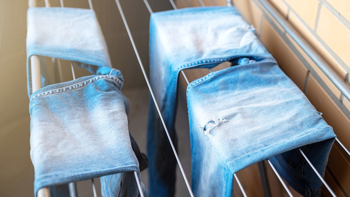 Jeans drying on a rack