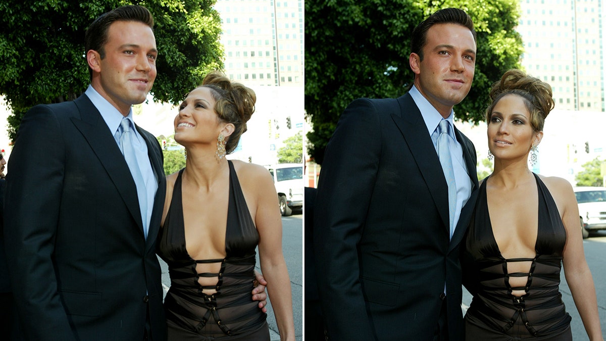 Ben Affleck in a black blazer and blue shirt smiles as Jennifer Lopez in a low cut black gown looks up at him split same event, positions slightly different
