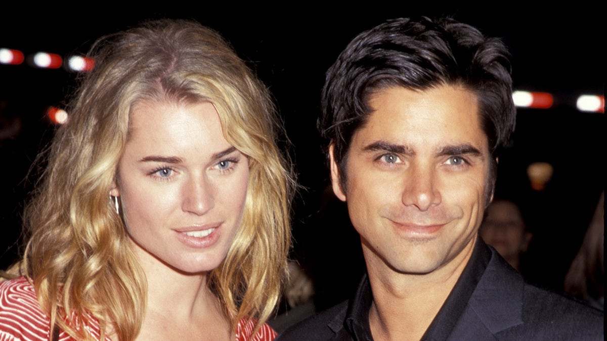 Rebecca Romijn and ex John stamos smile on red carpet