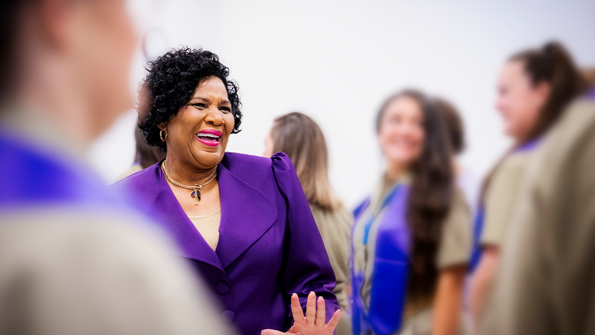 Alice Marie Johnson in purple outfit