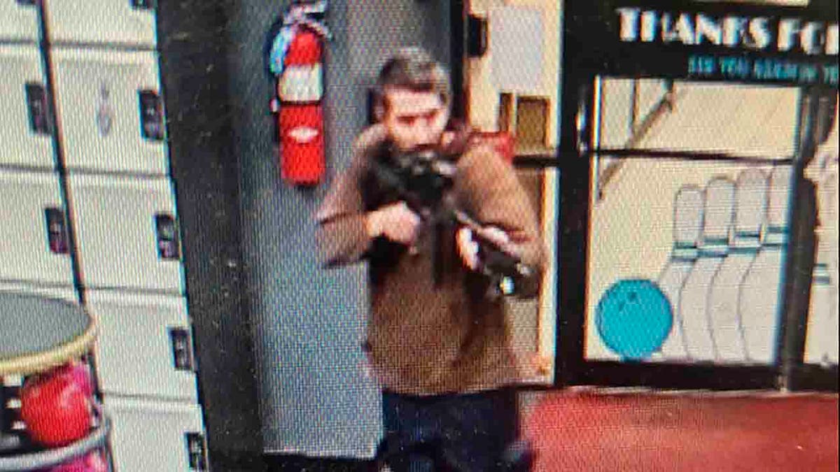 suspect with gun