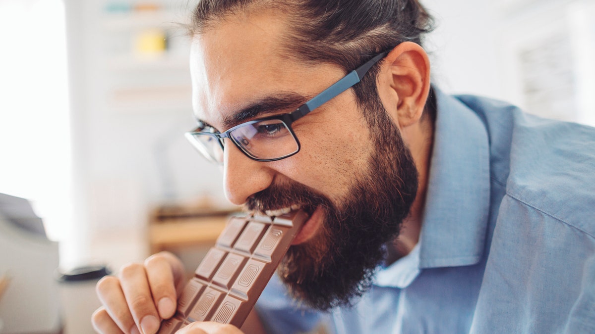 Man eating candy