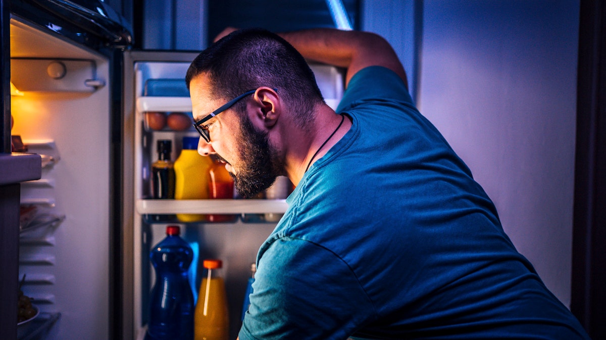 Man raiding fridge