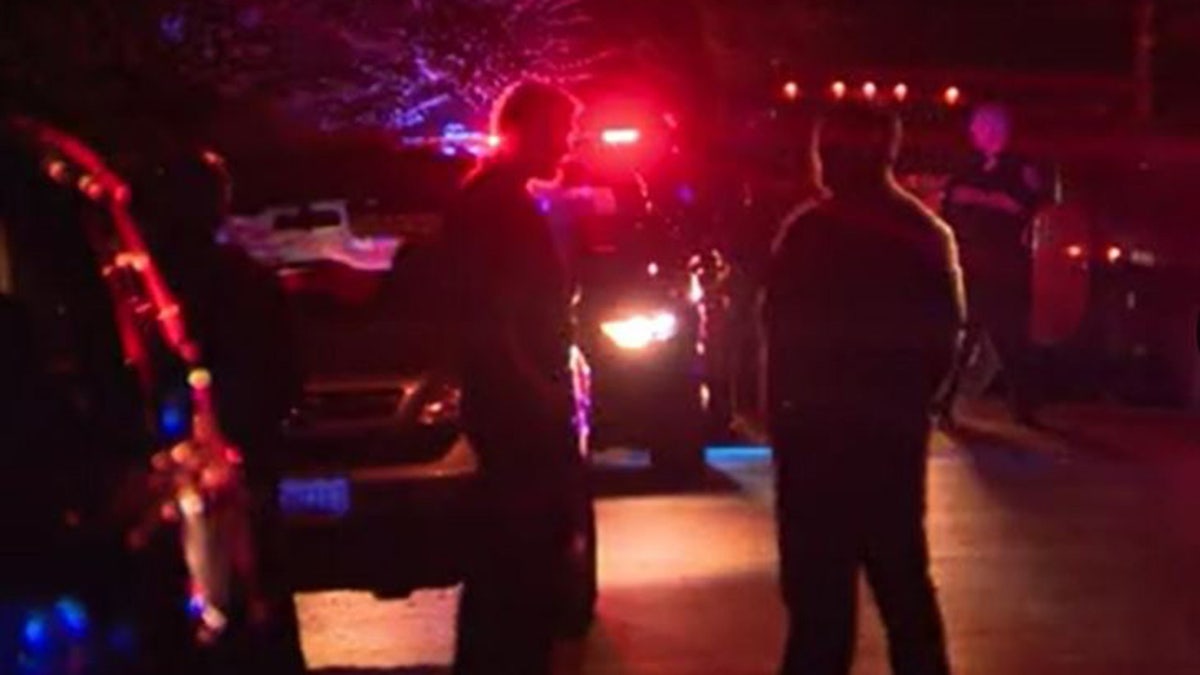 Investigators at the scene of the shooting