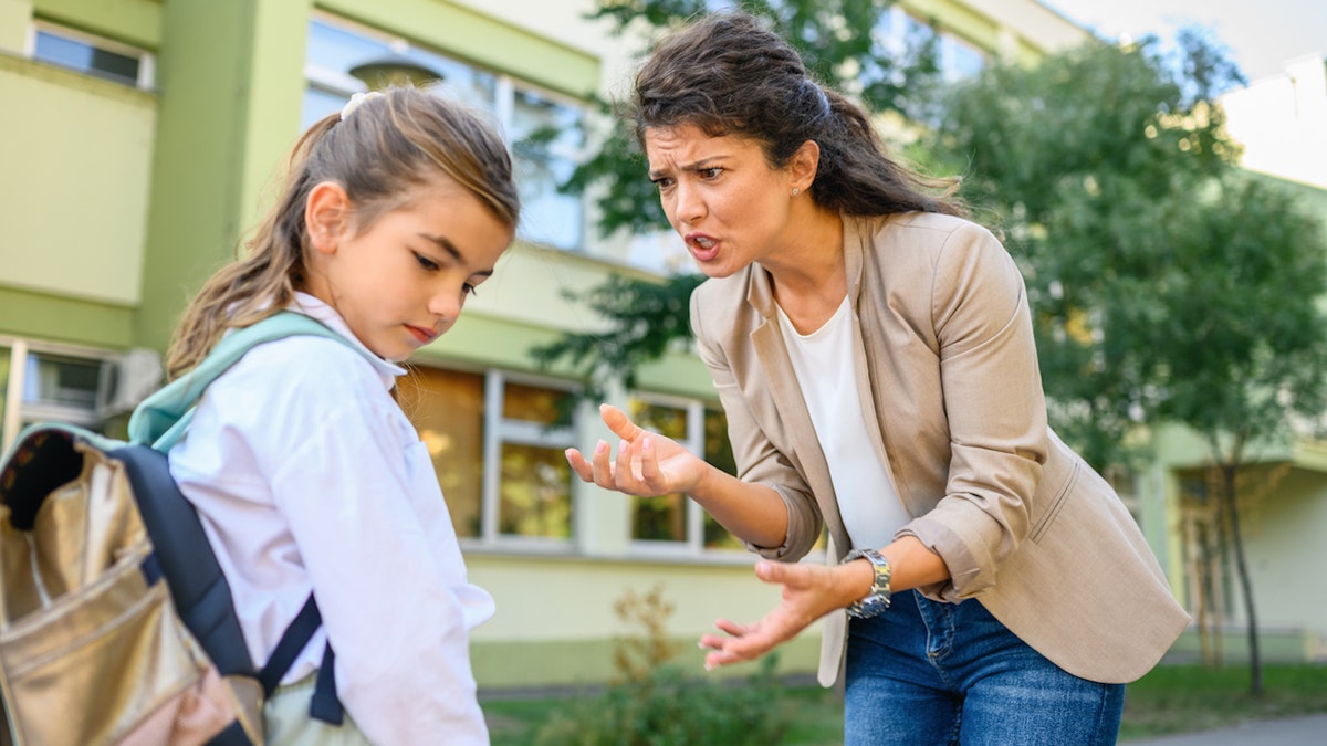 Mom scolding daughter