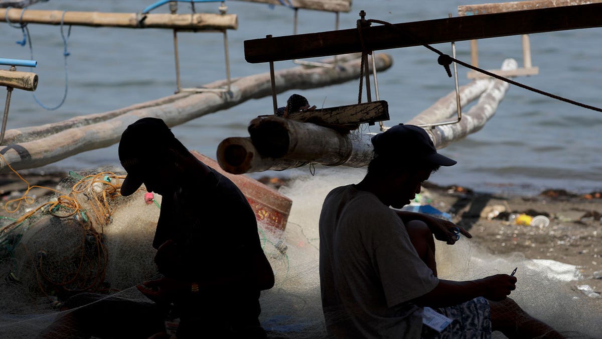 fishermen working on nets